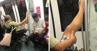 Image result for wheelchair man singapore feet up smrt gif