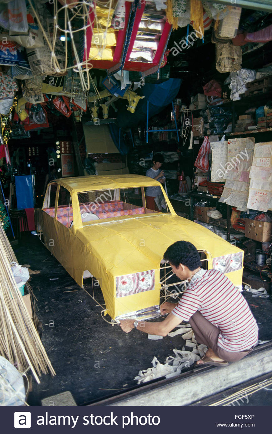 chinese-craftsman-completes-paper-replica-of-car-to-be-burnt-at-a-FCF5XP.jpg