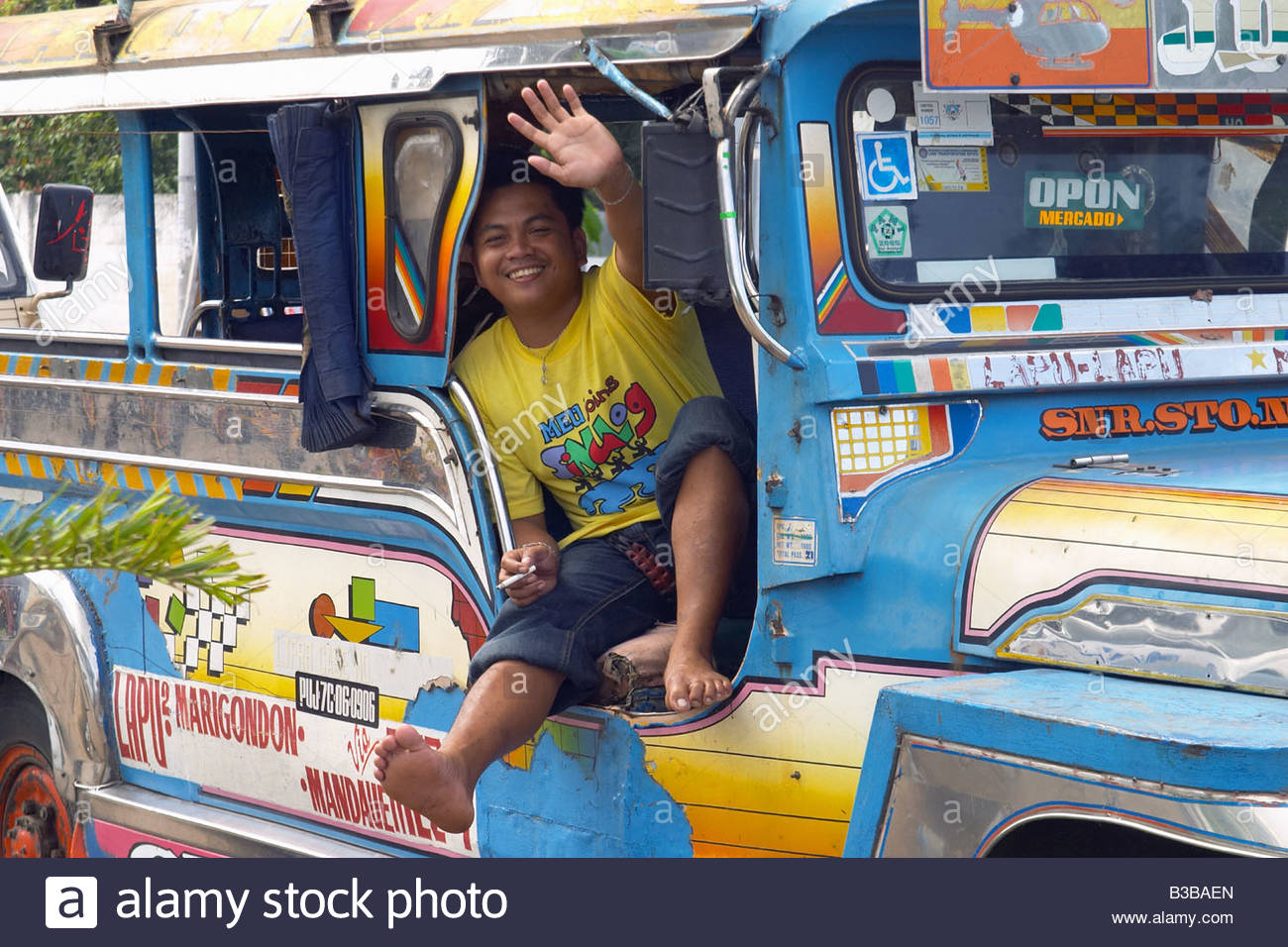 happy-jeepney-driver-enjoying-a-break-in-lapu-lapu-city-on-mactan-B3BAEN.jpg