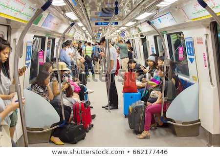 stock-photo-singapore-jan-passengers-in-singapore-mass-rapid-transit-mrt-train-the-mrt-has-662...jpg