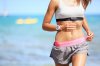 Bigstock-21109267-Runner-woman-with-heart-rate-monitor-running-on-beach-with-watch-and-sports-br.jpg