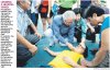 st-2011-07-24-dr-tony-tan-helping-injured-boy.jpg